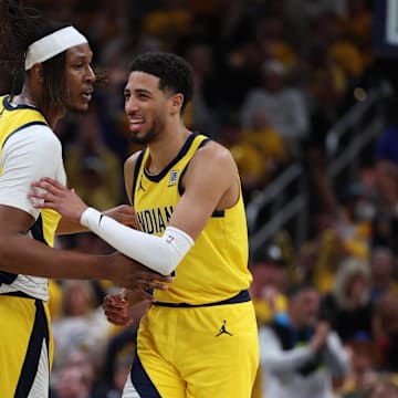 May 27, 2025; Indianapolis, Indiana, USA; Indiana Pacers guard Tyrese Haliburton (0) reacts with center Myles Turner (33) after shooting a three point basket during the second quarter against the New York Knicks of game four of the eastern conference finals for the 2025 NBA Playoffs at Gainbridge Fieldhouse. Mandatory Credit: Trevor Ruszkowski-Imagn Images