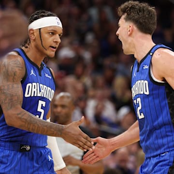 Feb 27, 2025; Orlando, Florida, USA; Orlando Magic forward Paolo Banchero (5) and forward Franz Wagner (22) celebrate after a basket against the Golden State Warriors in the second quarter at Kia Center. Mandatory Credit: Nathan Ray Seebeck-Imagn Images