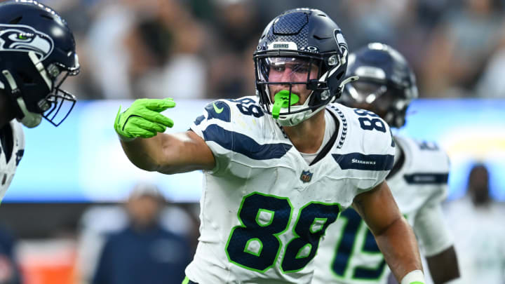 Aug 10, 2024; Inglewood, California, USA; Seattle Seahawks tight end AJ Barner (88) gestures to teammates against the Los Angeles Chargers during the fourth quarter at SoFi Stadium. Mandatory Credit: Jonathan Hui-USA TODAY Sports