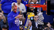 Scheyer cuts down the net after the Blue Devils won the East Regional to advance to the Final Four.