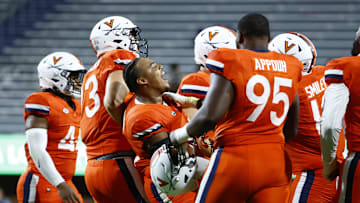 Aug 31, 2024; Charlottesville, Virginia, USA; Virginia Cavaliers defensive tackle Jason Hammond (91) celebrates with teammates in the final seconds of the second half against the Richmond Spiders at Scott Stadium. Mandatory Credit: Amber Searls-Imagn Images