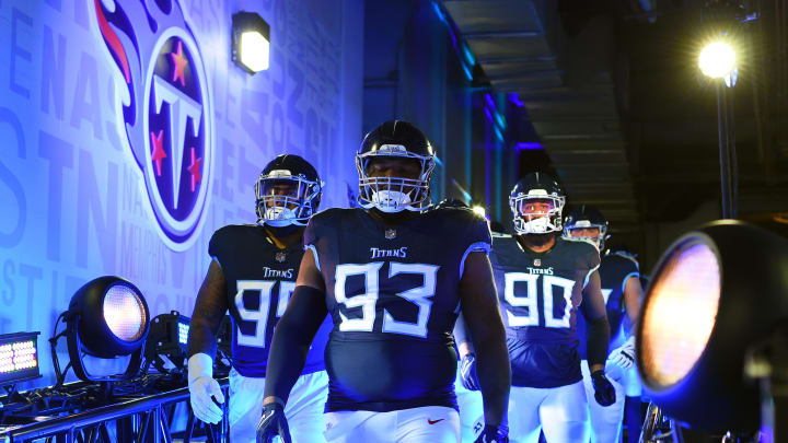 Nov 26, 2023; Nashville, Tennessee, USA; Tennessee Titans defensive tackle Teair Tart (93) leads teammates to the field before the game against the Carolina Panthers at Nissan Stadium. Mandatory Credit: Christopher Hanewinckel-USA TODAY Sports