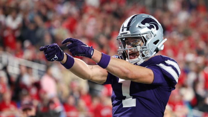 Dec 28, 2023; Orlando, FL, USA;  Kansas State Wildcats wide receiver Jayce Brown (1) celebrates after catching a pass for a touchdown against the North Carolina State Wolfpack in the fourth quarter during the Pop-Tarts bowl at Camping World Stadium. Mandatory Credit: Nathan Ray Seebeck-USA TODAY Sports