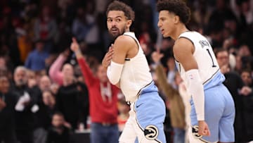 Dec 6, 2024; Atlanta, Georgia, USA; Atlanta Hawks guard Trae Young (11) reacts after a basket against the Los Angeles Lakers in overtime at State Farm Arena. Mandatory Credit: Brett Davis-Imagn Images
