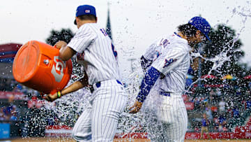 South Bend Cubs outfielder Brett Bateman, left, throws water on infielder Jonathon Long after winning a minor league baseball 4-3 against the Lake County Captains game at Four Winds Field on Friday, June 21, 2024, in South Bend.