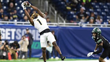 Dec 3, 2022; Detroit, Michigan, USA;  Toledo wide receiver Jerjuan Newton (1) makes a leaping catch for a first down against Ohio University in the second quarter at Ford Field. 