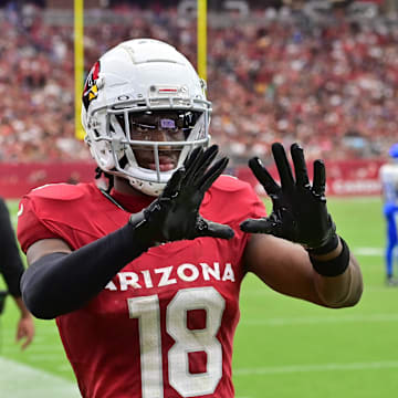 Sep 15, 2024; Glendale, Arizona, USA;  Arizona Cardinals wide receiver Marvin Harrison Jr. (18) catches a ball on the sideline in the first half against the Los Angeles Rams at State Farm Stadium. Mandatory Credit: Matt Kartozian-Imagn Images