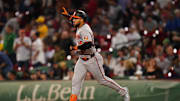 Sep 11, 2024; Boston, Massachusetts, USA; Baltimore Orioles designated hitter Anthony Santander (25) hits a home run against the Boston Red Sox in the eighth inning at Fenway Park.