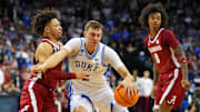 Mar 29, 2025; Newark, NJ, USA; Duke Blue Devils forward Cooper Flagg (2) drives to the basket against Alabama Crimson Tide guard Mark Sears (1) during the second half in the East Regional final of the 2025 NCAA tournament at Prudential Center. Mandatory Credit: Robert Deutsch-Imagn Images