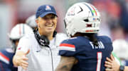 Nov 22, 2025; Tucson, Arizona, USA; Arizona Wildcats head coach Brent Brennan celebrates with quarterback Noah Fifita (1) against the Baylor Bears at Casino Del Sol Stadium. Mandatory Credit: Mark J. Rebilas-Imagn Images