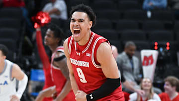 Mar 14, 2025; Indianapolis, IN, USA; Wisconsin Badgers guard John Tonje (9) celebrates after a play during the second half against the UCLA Bruins at Gainbridge Fieldhouse. Mandatory Credit: Robert Goddin-Imagn Images