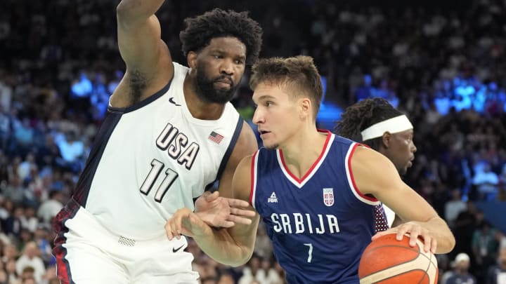 Aug 8, 2024; Paris, France; Serbia shooting guard Bogdan Bogdanovic (7) dribbles the ball while defended by United States centre Joel Embiid (11) during the first half in a men's basketball semifinal game during the Paris 2024 Olympic Summer Games at Accor Arena. Mandatory Credit: Kyle Terada-USA TODAY Sports