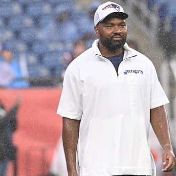 August 8, 2024; Foxborough, MA, USA;  New England Patriots head coach Jerod Mayo  watches as the team warms up before a game against the Carolina Panthers at Gillette Stadium.