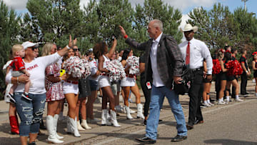 Sep 16, 2023; Lubbock, Texas, USA;  Texas Tech Red Raiders head coach Joey McGuire greets fans outside Jones AT&T Stadium and Cody Campbell Field before the game against the Tarleton State Texans. Mandatory Credit: Michael C. Johnson-Imagn Images