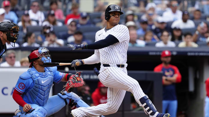 Aug 31, 2024; Bronx, New York, USA; New York Yankees right fielder Juan Soto (22) hits a double against the St. Louis Cardinals during the ninth inning at Yankee Stadium. Mandatory Credit: Gregory Fisher-USA TODAY Sports