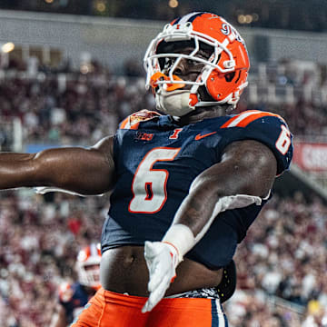 Dec 31, 2024; Orlando, FL, USA; Illinois Fighting Illini running back Josh McCray (6) celebrates his touchdown against the South Carolina Gamecocks in the fourth quarter at Camping World Stadium. Mandatory Credit: Jeremy Reper-Imagn Images