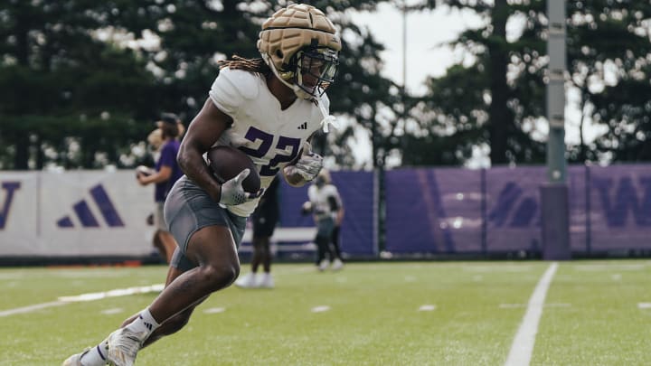 Cam Davis heads upfield on the East practice field. 