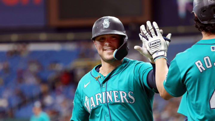 Jun 25, 2024; St. Petersburg, Florida, USA; Seattle Mariners first baseman Ty France (23) is congratulated by third base Josh Rojas (4) after he hit a two-run home run against the Tampa Bay Rays during the fifth inning at Tropicana Field. Mandatory Credit: Kim Klement Neitzel-USA TODAY Sports