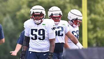 Aug 03, 2024; Foxborough, MA, USA; New England Patriots offensive tackle Vederian Lowe (59) waits to do a drill during training camp at Gillette Stadium. Mandatory Credit: Eric Canha-Imagn Images
