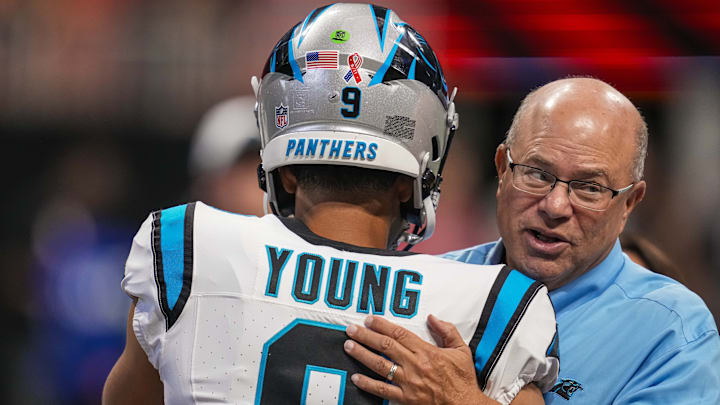 Sep 10, 2023; Atlanta, Georgia, USA; Carolina Panthers quarterback Bryce Young (9) hugs team owner David Tepper on the field prior to the game against the Atlanta Falcons at Mercedes-Benz Stadium.