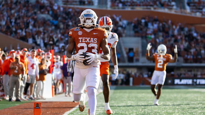 Dec 21, 2024; Austin, Texas, USA; Texas Longhorns running back Jaydon Blue (23) scores a touchdown against the Clemson Tigers during the first half of the CFP National playoff first round at Darrell K Royal-Texas Memorial Stadium. Mandatory Credit: Mark J. Rebilas-Imagn Imagesn Images Dec 21, 2024; Austin, Texas, USA; Texas Longhorns running back Jaydon Blue (23) scores a touchdown against the Clemson Tigers during the first half of the CFP National playoff first round at Darrell K Royal-Texas Memorial Stadium. Mandatory Credit: Mark J. Rebilas-Imagn Imagesn Images