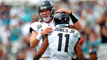 Sep 19, 2021; Jacksonville, Florida, USA; Jacksonville Jaguars quarterback Trevor Lawrence (16) with wide receiver Marvin Jones (11) against the Denver Broncos at TIAA Bank Field. 