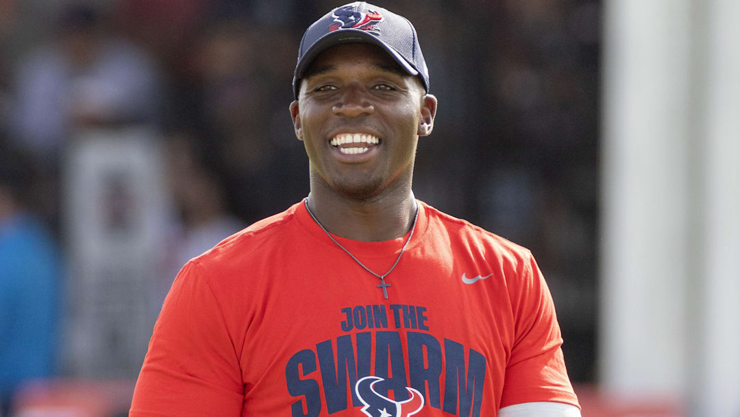 Houston Texans head coach DeMeco Ryans watches players warm up during training camp practice at the Houston Methodist Training Center.