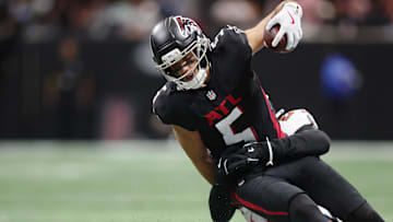 Tampa Bay Buccaneers linebacker Lavonte David (54) tackles Atlanta Falcons wide receiver Drake London (5) as he runs out of bounds during the second quarter at Mercedes-Benz Stadium.