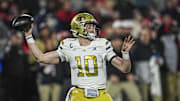 Nov 29, 2024; Athens, Georgia, USA; Georgia Tech Yellow Jackets quarterback Haynes King (10) passes the ball against the Georgia Bulldogs during the first quarter at Sanford Stadium. Mandatory Credit: Dale Zanine-Imagn Images