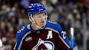 Nov 13, 2025; Denver, Colorado, USA; Colorado Avalanche center Nathan MacKinnon (29) reacts in the first period against the Buffalo Sabres at Ball Arena. Mandatory Credit: Ron Chenoy-Imagn Images