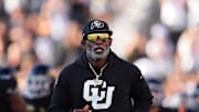 Aug 29, 2024; Boulder, Colorado, USA; Colorado Buffaloes head coach Deion Sanders runs onto the field before the game against the North Dakota State Bison at Folsom Field. Mandatory Credit: Ron Chenoy-Imagn Images