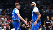Oct 24, 2025; Dallas, Texas, USA;  Dallas Mavericks forward Cooper Flagg (32) celebrates with Dallas Mavericks forward Anthony Davis (3) during the first quarter against the Washington Wizards at American Airlines Center. Mandatory Credit: Kevin Jairaj-Imagn Images