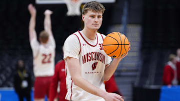 Mar 19, 2025; Denver, CO, USA; Wisconsin Badgers forward Nolan Winter (31) warms up during practice at Ball Arena. Mandatory Credit: Ron Chenoy-Imagn Images