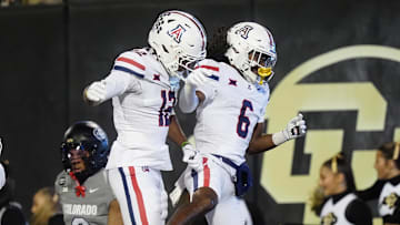 Nov 1, 2025; Boulder, Colorado, USA; Arizona Wildcats wide receiver Javin Whatley (6) celebrates his touchdown with wide receiver Tre Spivey (12) second quarter against the Colorado Buffaloes at Folsom Field. Mandatory Credit: Ron Chenoy-Imagn Images