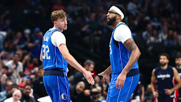 Oct 24, 2025; Dallas, Texas, USA;  Dallas Mavericks forward Cooper Flagg (32) celebrates with Dallas Mavericks forward Anthony Davis (3) during the first quarter against the Washington Wizards at American Airlines Center. Mandatory Credit: Kevin Jairaj-Imagn Images