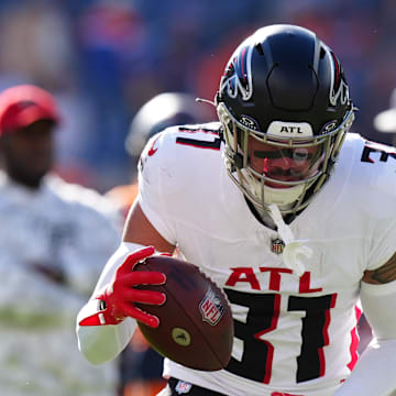 Nov 17, 2024; Denver, Colorado, USA; Atlanta Falcons safety Justin Simmons (31) warms up before the game against the Denver Broncos at Empower Field at Mile High. Mandatory Credit: Ron Chenoy-Imagn Images