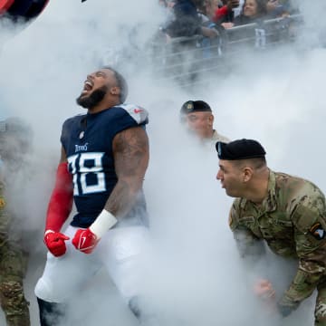 Tennessee Titans defensive tackle Jeffery Simmons (98) makes his entrance with service members from Fort Campbell before their game at Nissan Stadium in Nashville, Tenn., Sunday, Nov. 26, 2023.