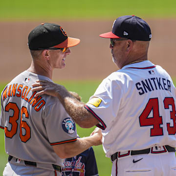 Jul 6, 2025; Cumberland, Georgia, USA; Baltimore Orioles interim manager Tony Mansolino (36) and Atlanta Braves manager Brian Snitker (43) meet on the field before the game at Truist Park. Mandatory Credit: Dale Zanine-Imagn Images