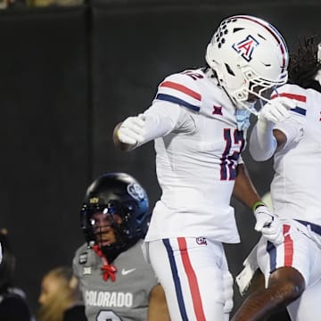 Nov 1, 2025; Boulder, Colorado, USA; Arizona Wildcats wide receiver Javin Whatley (6) celebrates his touchdown with wide receiver Tre Spivey (12) second quarter against the Colorado Buffaloes at Folsom Field. Mandatory Credit: Ron Chenoy-Imagn Images