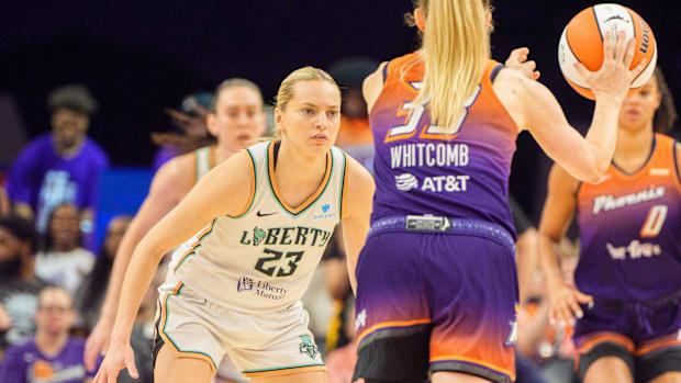 A photo of Sami Whitcomb being guarded by Marine Johannes