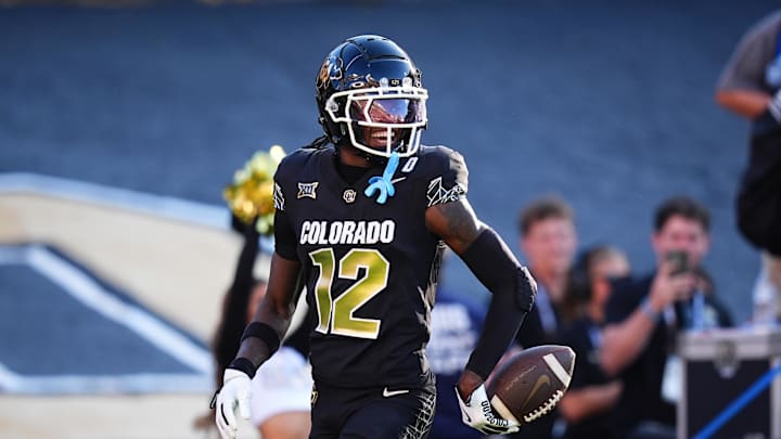 Aug 29, 2024; Boulder, Colorado, USA; Colorado Buffaloes wide receiver Travis Hunter (12) reacts after scoring a touchdown in the first half against the North Dakota State Bison at Folsom Field. Mandatory Credit: Ron Chenoy-Imagn Images