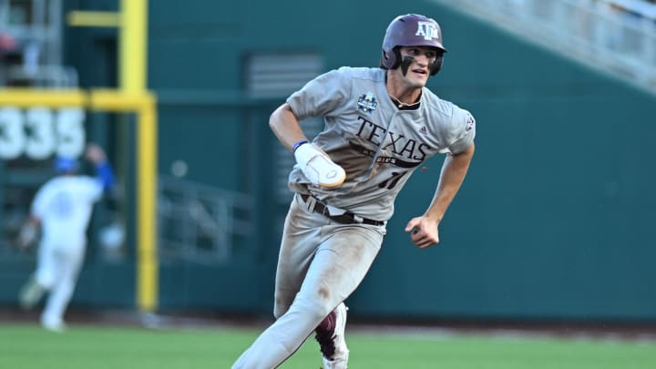 Jun 17, 2024; Omaha, NE, USA;  Texas A&M Aggies outfielder Jace Laviolette (17) takes third base against the Kentucky Wildcats during the sixth inning at Charles Schwab Field Omaha. Mandatory Credit: Steven Branscombe-USA TODAY Sports