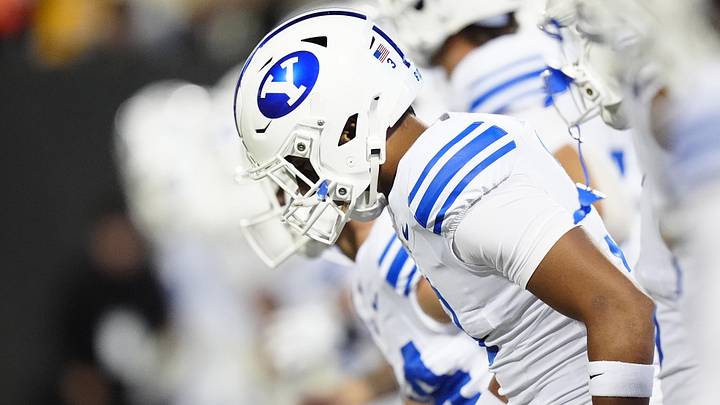 Sep 27, 2025; Boulder, Colorado, USA; Members of the Brigham Young Cougars warm up before the game against the Colorado Buffaloes at Folsom Field. Mandatory Credit: Ron Chenoy-Imagn Images