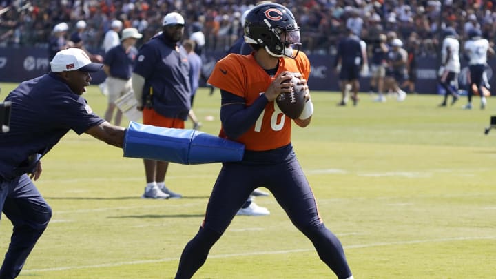 Jul 27, 2024; Lake Forest, IL, USA; Chicago Bears quarterback Caleb Williams (18) throws  a pass during Chicago Bears Training Camp at Halas Hall. Mandatory Credit: David Banks-USA TODAY Sports