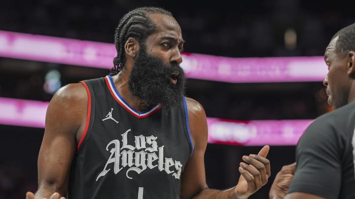 LA Clippers guard James Harden (1) talks with referee Dedric Taylor (21) during the first quarter against the Charlotte Hornets at Spectrum Center. Mandatory Credit: 