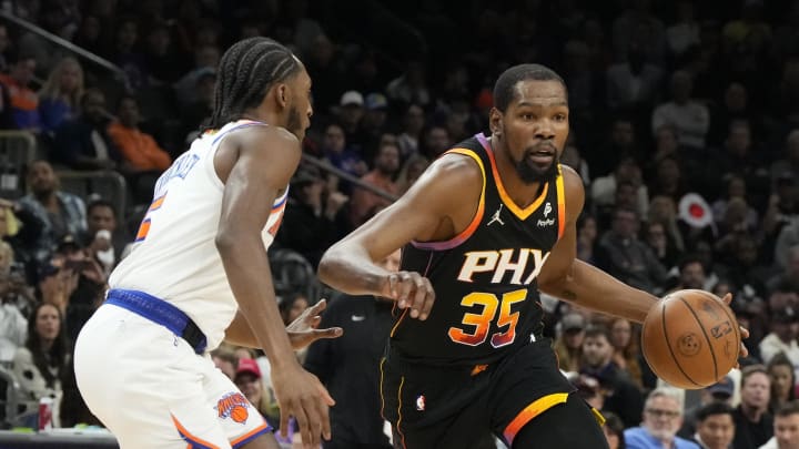 Dec 15, 2023; Phoenix, Arizona, USA; Phoenix Suns forward Kevin Durant (35) drives on New York Knicks guard Immanuel Quickley (5) in the first half at Footprint Center. Mandatory Credit: Rick Scuteri-USA TODAY Sports