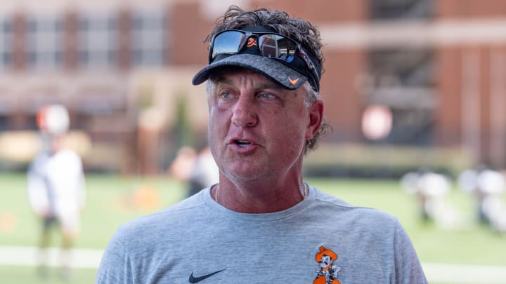 Head coach Mike Gundy walks on the field during an Oklahoma State football practice in Stillwater, Okla., on Wednesday, July 31, 2024.