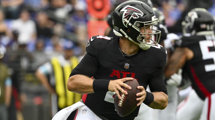 Aug 17, 2024; Baltimore, Maryland, USA;  Atlanta Falcons quarterback Taylor Heinicke (4) rolls pout to pass during the first half against the Baltimore Ravens at M&T Bank Stadium. Mandatory Credit: Tommy Gilligan-USA TODAY Sports