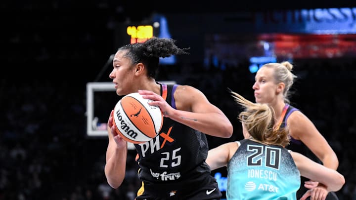 Jun 19, 2025; Brooklyn, New York, USA; Phoenix Mercury forward Alyssa Thomas (25) looks to pass the ball against the New York Liberty during the second half at Barclays Center. Mandatory Credit: John Jones-Imagn Images
