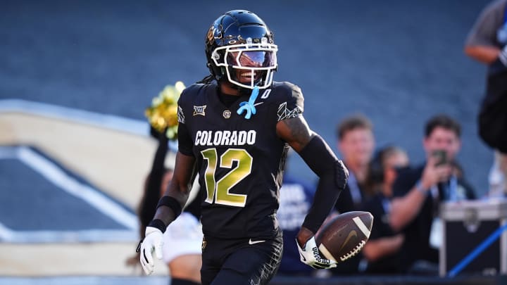 Aug 29, 2024; Boulder, Colorado, USA; Colorado Buffaloes wide receiver Travis Hunter (12) reacts after scoring a touchdown in the first half against the North Dakota State Bison at Folsom Field. Mandatory Credit: Ron Chenoy-USA TODAY Sports